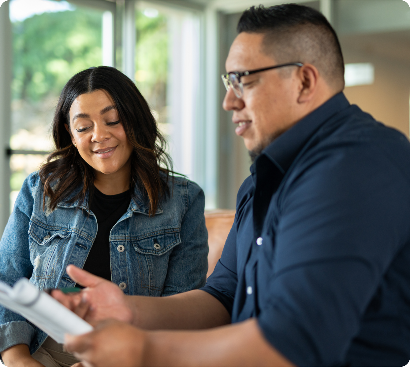 two people reading a brochure