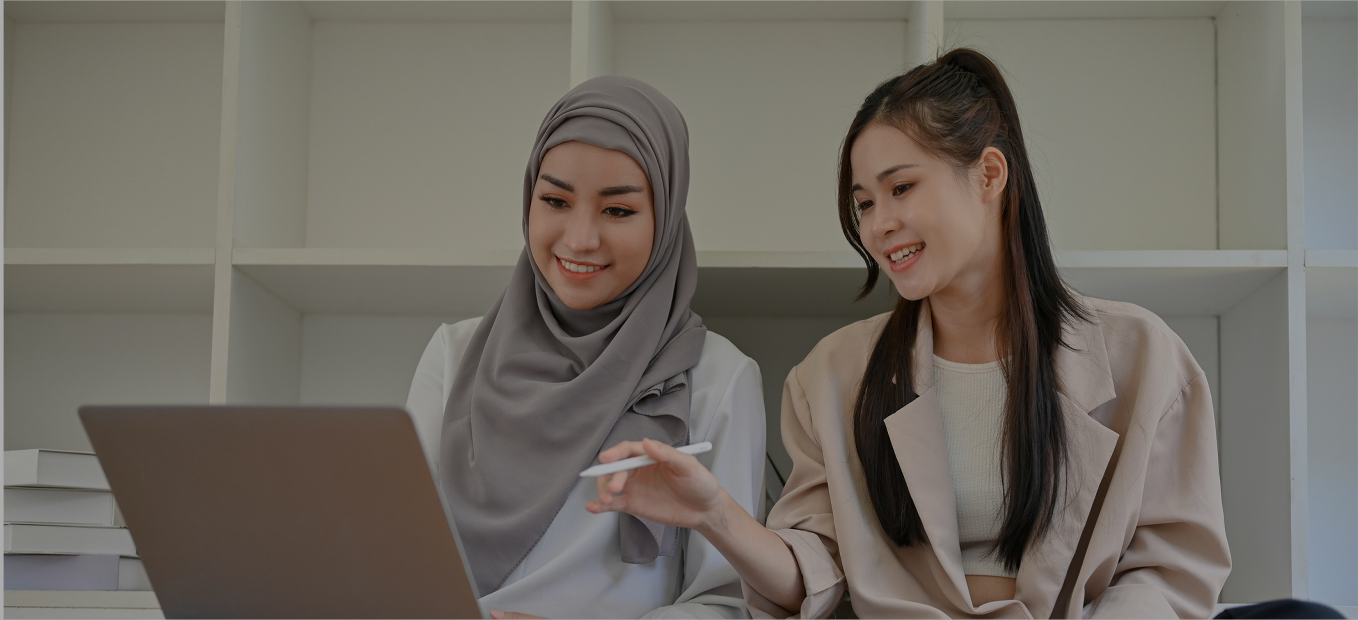 two people looking at laptop