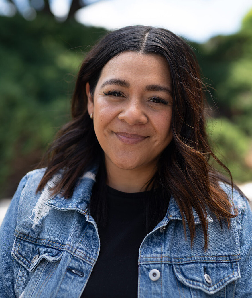 headshot of woman in jean jacket