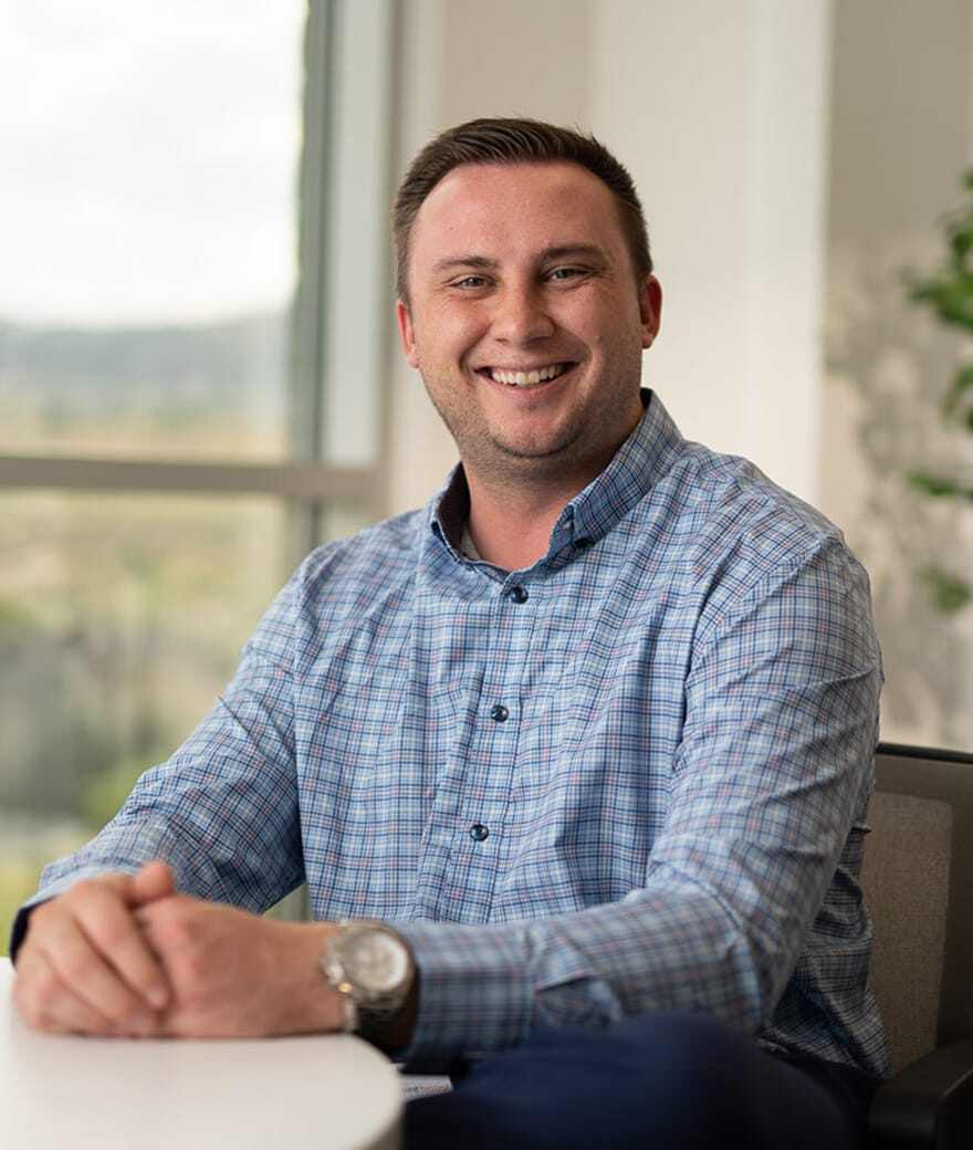 Professional looking man sitting with hands folded