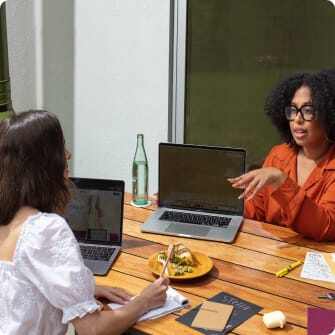 two women talking over lunch