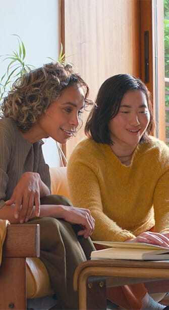 two people looking at laptop